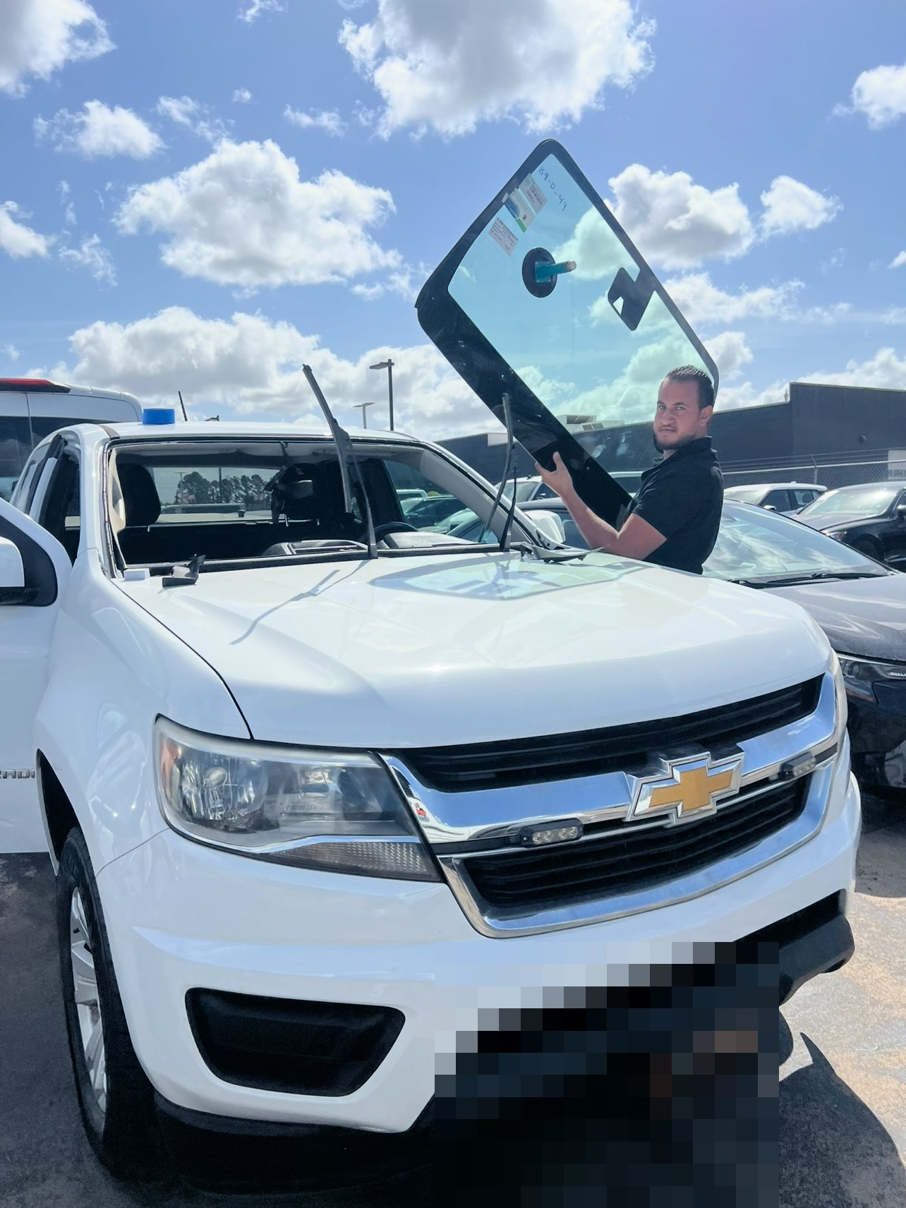 Super Windshield technician installing a new windshield on-site in Houston